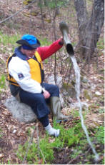 Larry empties boot after going in with Ron on Trout River - 2002